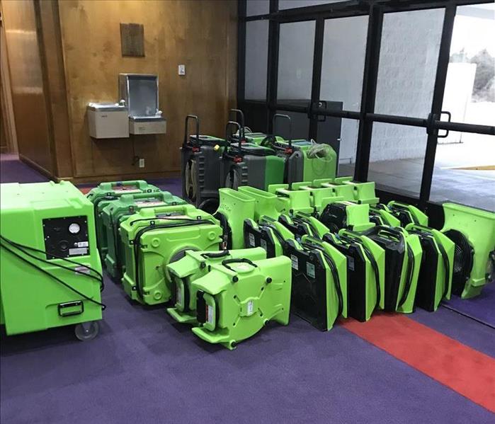 Rows of Green drying equipment in a lobby 