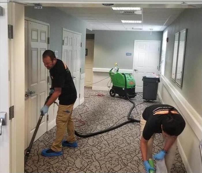 SERVPRO techs removing water from commercial facilities